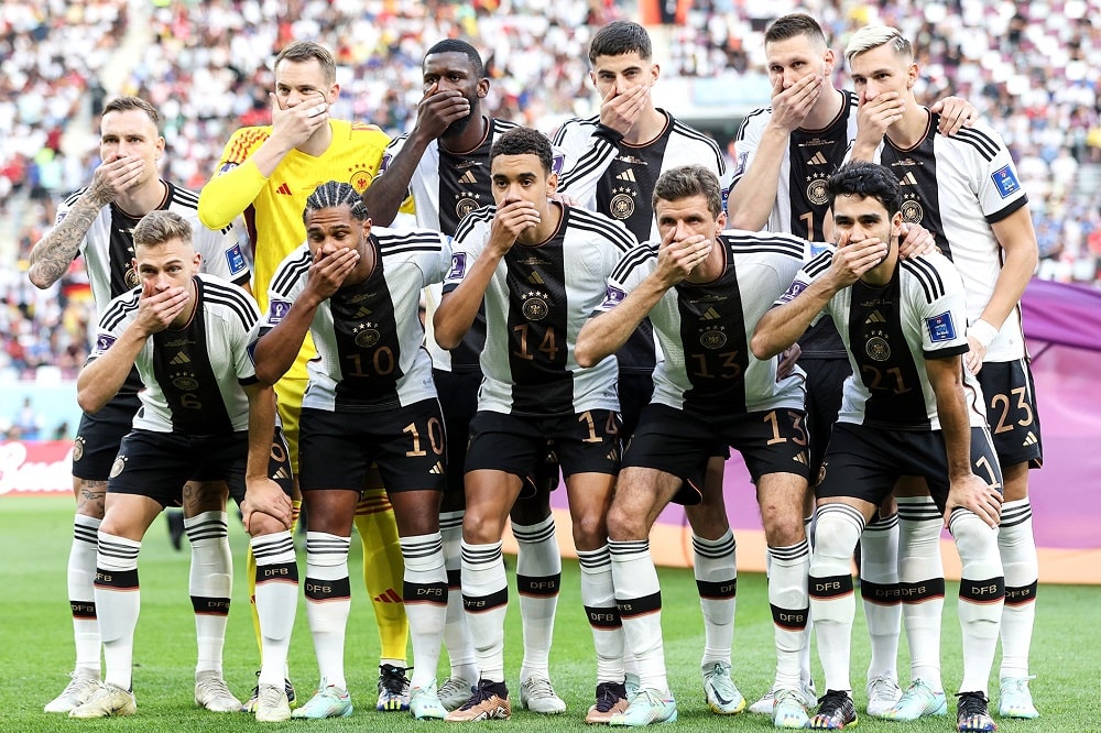 German players covered their faces for a photo session to PROTEST FIFA’s DECISION
